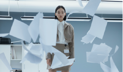 professional woman among scattered papers